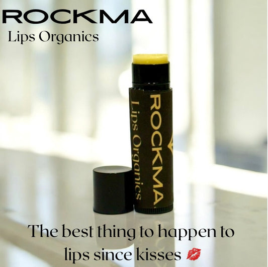 Lip balm with 'ROCKMA Lips Organics' branding on a reflective surface. Best lip balm and organic lip balm.